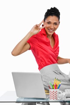 Portrait of a businesswoman making a peace sign and smiling