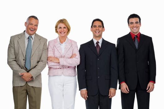 Portrait of a businesswoman standing with three businessmen and smiling