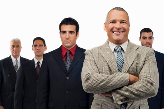 Portrait of a businessman smiling with four businessmen standing behind him