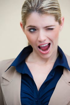 Close-up of a businesswoman winking