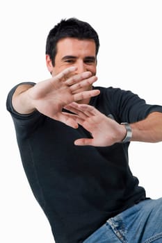 Close-up of a young man gesturing and smiling