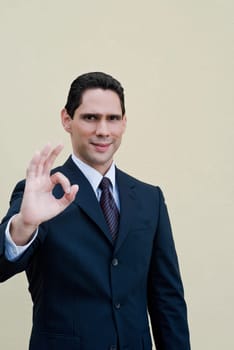 Portrait of a businessman making an Ok Sign