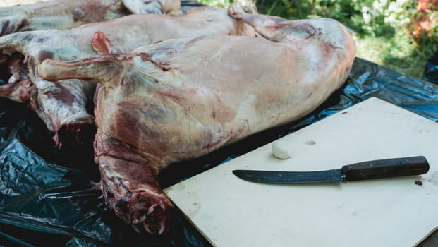 carcass of sheep, cutting the carcass of a sheep. meat slaughterhouse.