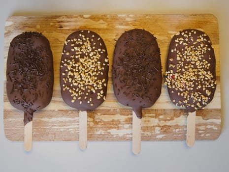 Ice cream popsicle on a wooden board.