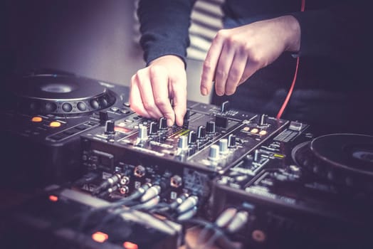 DJ at the remote control. Mixer remote at the concert. Musical equipment.