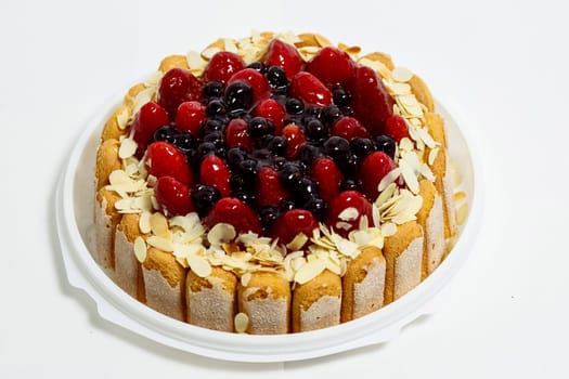 Cake with strawberries and currants. Cake on a white background.