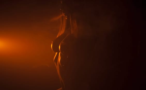 Nude woman in dark red counter light. in dark red counter light.