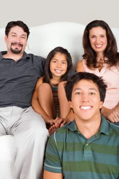 Portrait of a mid adult couple with their son and daughter