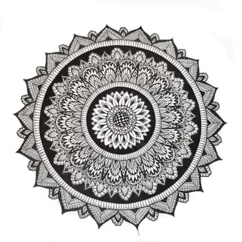 Painted ink on paper circle with patterns.
