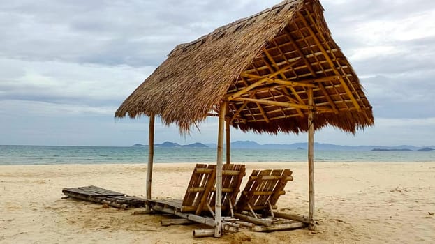 A canopy of bamboo and reeds on the beach.