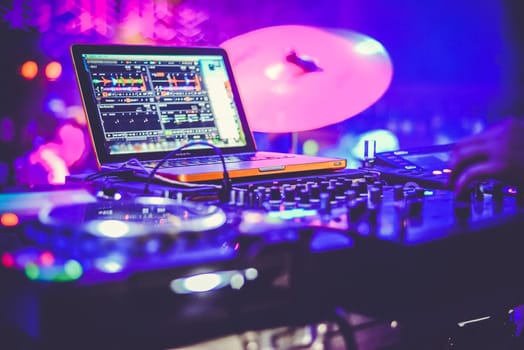 DJ at the remote control. Mixer remote at the concert. Musical equipment.