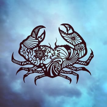 Crab figurine made of paper against the blue sky. Figurine of an animal.