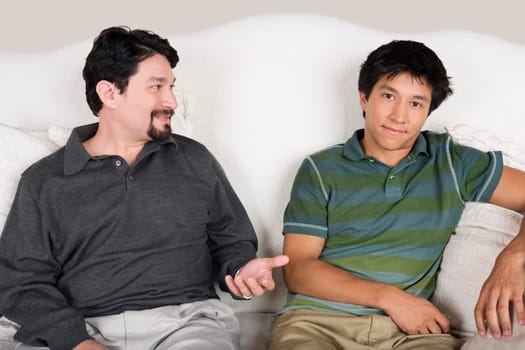 Mid adult man talking to his son
