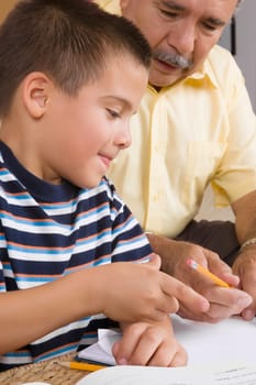 Close-up of a senior man teaching his grandson