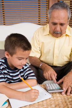 Senior man teaching his grandson