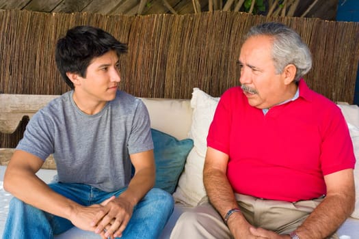 Senior man talking to his grandson