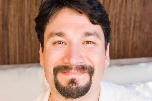 Portrait of a mid adult man smirking