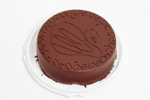 Cake in chocolate glaze on a white background. Chocolate cake.
