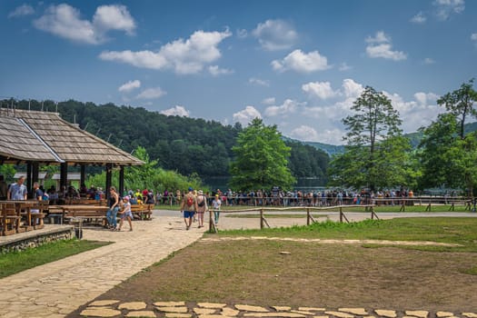 Plitvicka Jezera, Croatia, July 2019 Tourists in wooden restaurant and queuing for ferry in Plitvice Lakes National Park UNESCO World Heritage