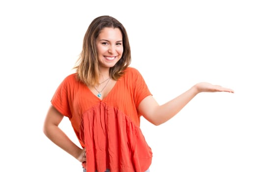 Young beautiful woman presenting your product, isolated over white background