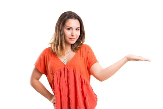 Young beautiful woman presenting your product, isolated over white background
