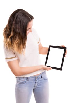 Happy young woman presenting your product in a tablet computer