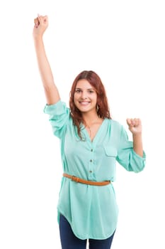 Studio shot: Happy woman with raised arms