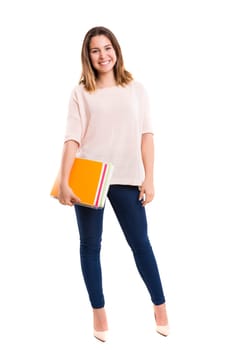 Young student posing over a white background