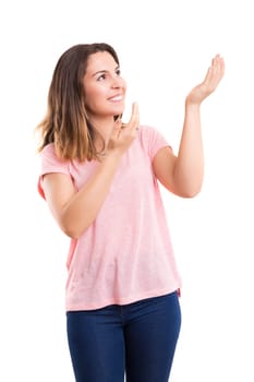 Young beautiful woman presenting your product, isolated over white background