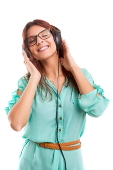 A Happy young woman listening to music