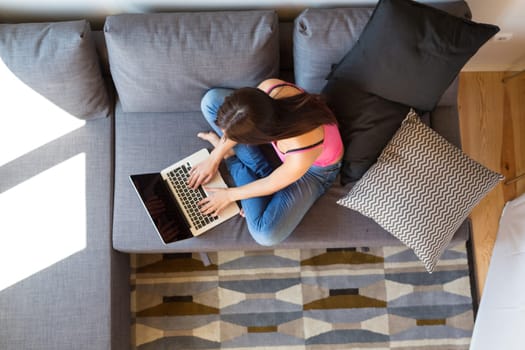 Beautiful woman relaxing with a computer