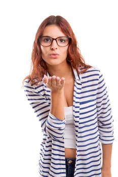 Beautiful young woman blowing you a kiss, isolated over white