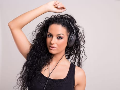 A Happy young woman listening to music