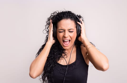 A Happy young woman listening to music