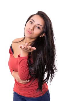 Beautiful young woman blowing you a kiss, isolated over white