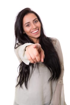 Young beautiful woman pointing at you, isolated over white