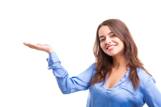 Young beautiful woman presenting your product, isolated over white background