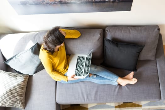 Beautiful woman relaxing with a computer