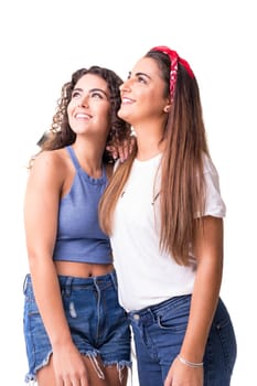 Two friends posing in studio isolated over a white background