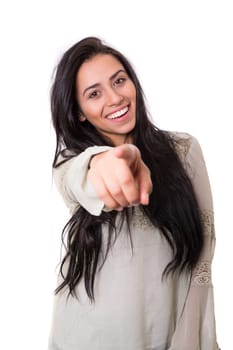 Young beautiful woman pointing at you, isolated over white