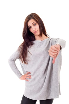 Studio shot of a young woman signaling thumbs down