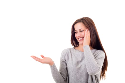Young beautiful woman presenting your product, isolated over white background