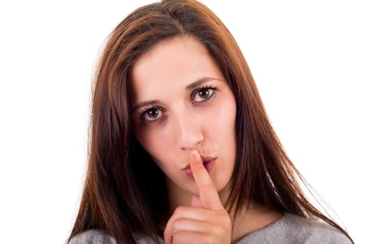 Beautiful young woman asking for silence isolated