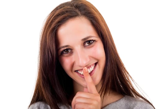 Beautiful young woman asking for silence isolated