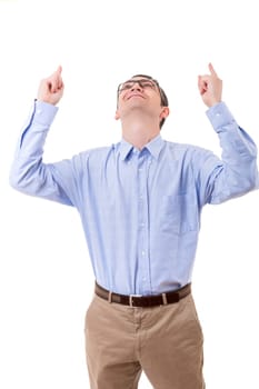 Happy young man celebrating with arms open