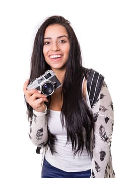 Beautiful woman holding a vintage camera, isolated over white background
