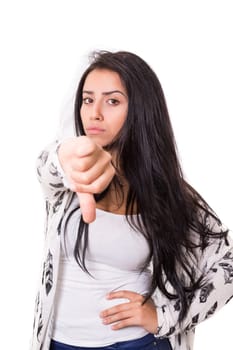 Studio shot of a young woman signaling thumbs down