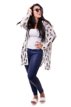 Beautiful young woman with sunglasses posing in studio, isolated over white
