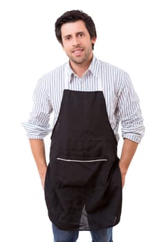 Portrait of handsome young man with apron against white background