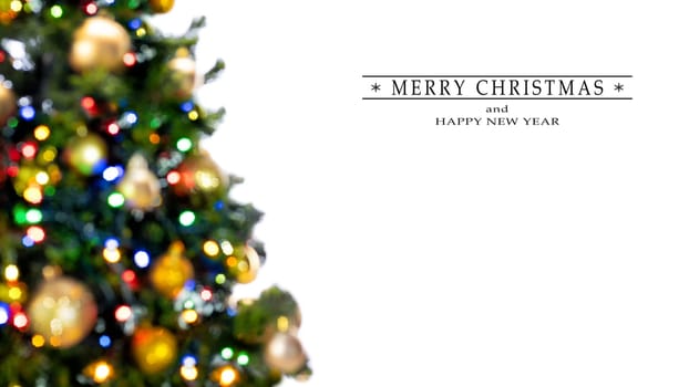 Merry Christmas and Happy New Year greeting card, blurred background of the twinkling lights of the Christmas tree. Greeting card background.